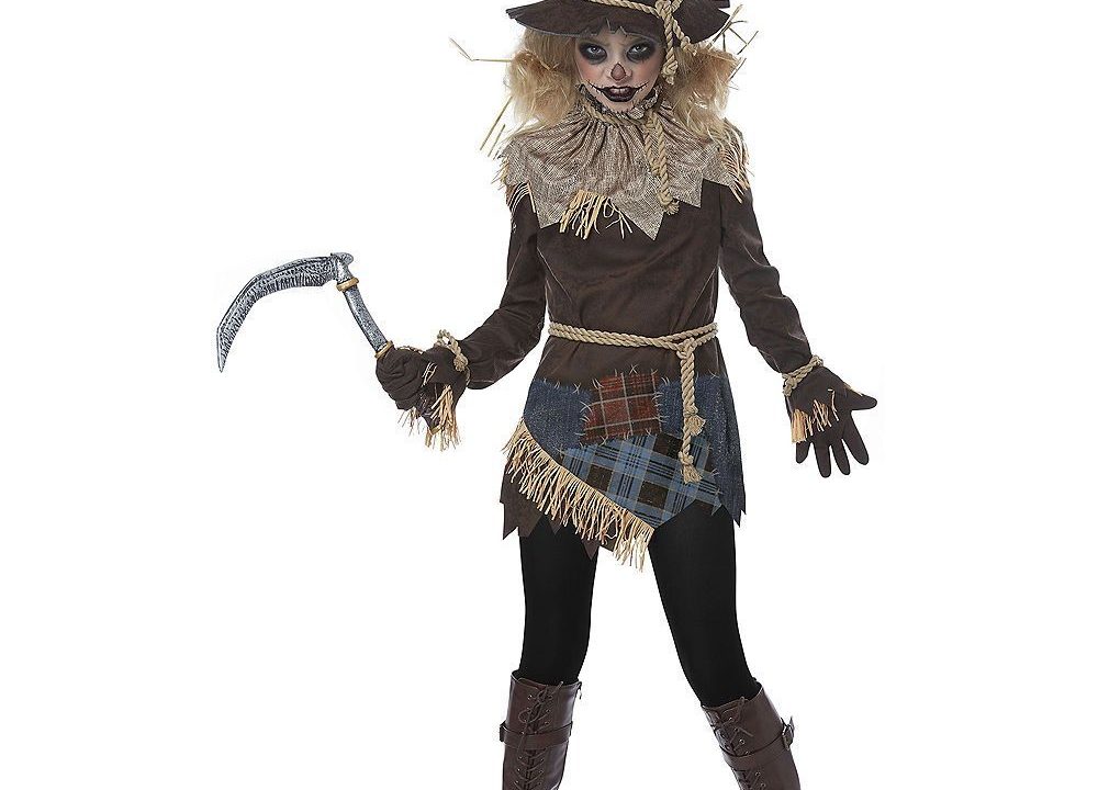 woman in a scary scarecrow costume holding a fake scythe, ready for Halloween trick-or-treating